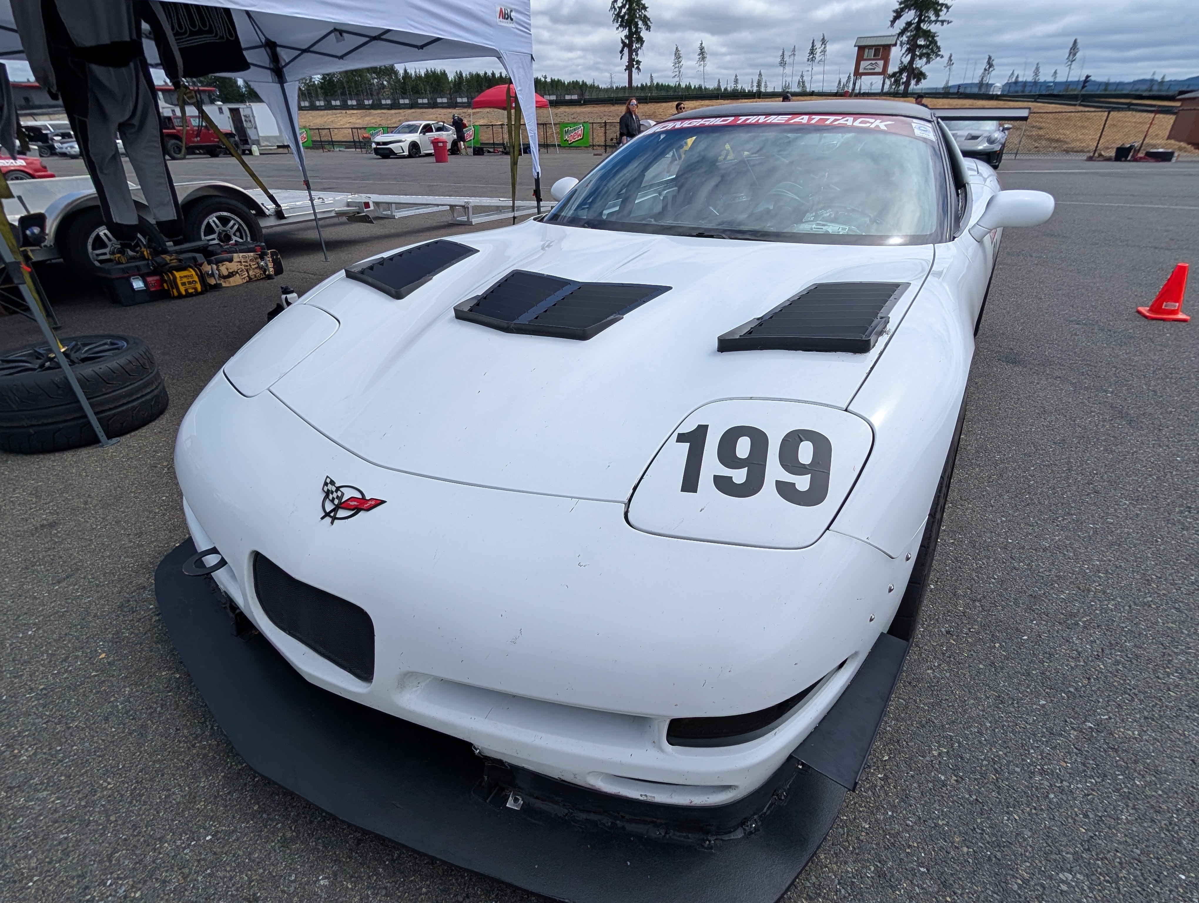 A front view of #199 C5 Corvette in the pits.
