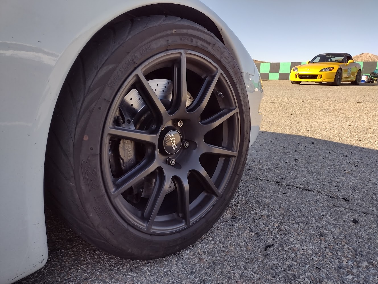 An 18x11 Wheel on the front of a C5 Corvette. Specifically an APEX SM10 ET57 flow forged wheel.