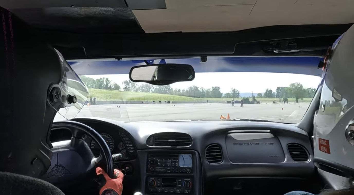 A gopro still shot looking from behind the occupants of the Dead to Shred Corvette on the Autocross course.