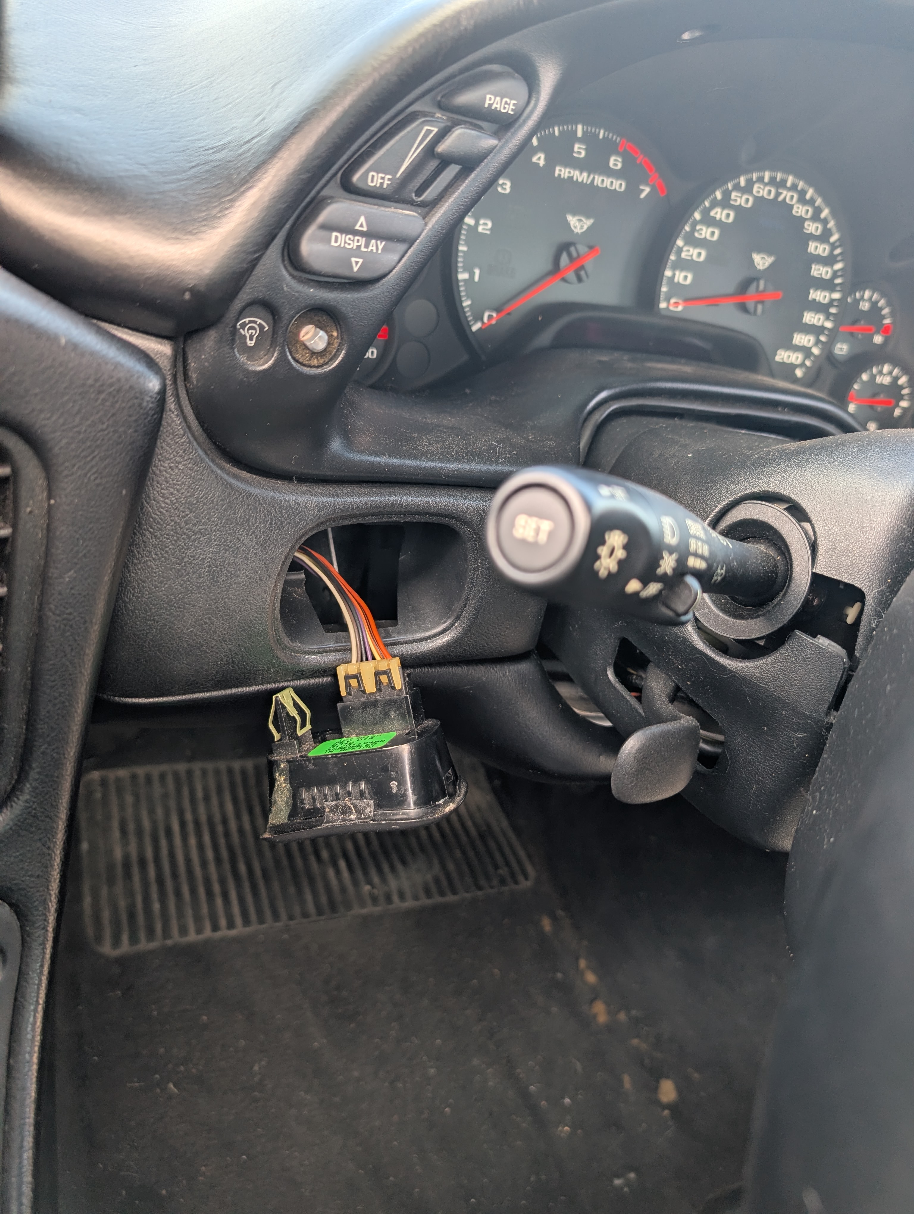 The interior of the Dead To Shred Corvette, where the buttons for the trunk opening and fog lights fell out of the dash while racing autocross.
