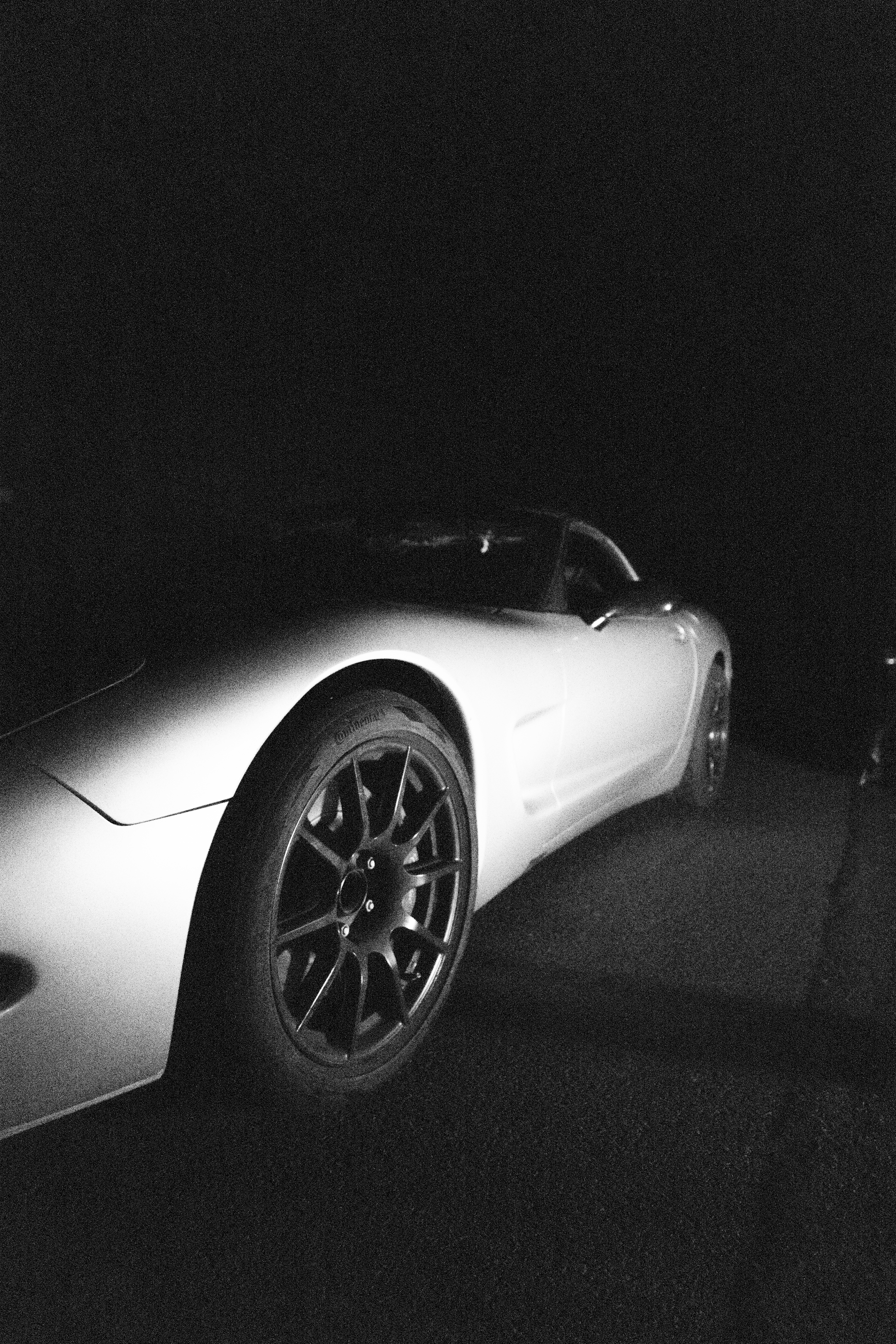 A night time black and white shot of the Dead to Shred C5 Corvette at Oregon Raceway Park