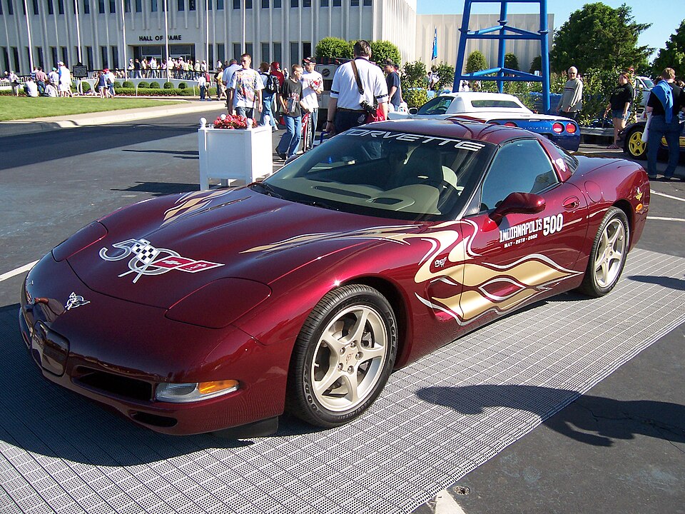 The official 2002 Chevy Corvette C5 Indy 500 pace car, which is crimson with gold decals. (photo credit: WikiCommons).