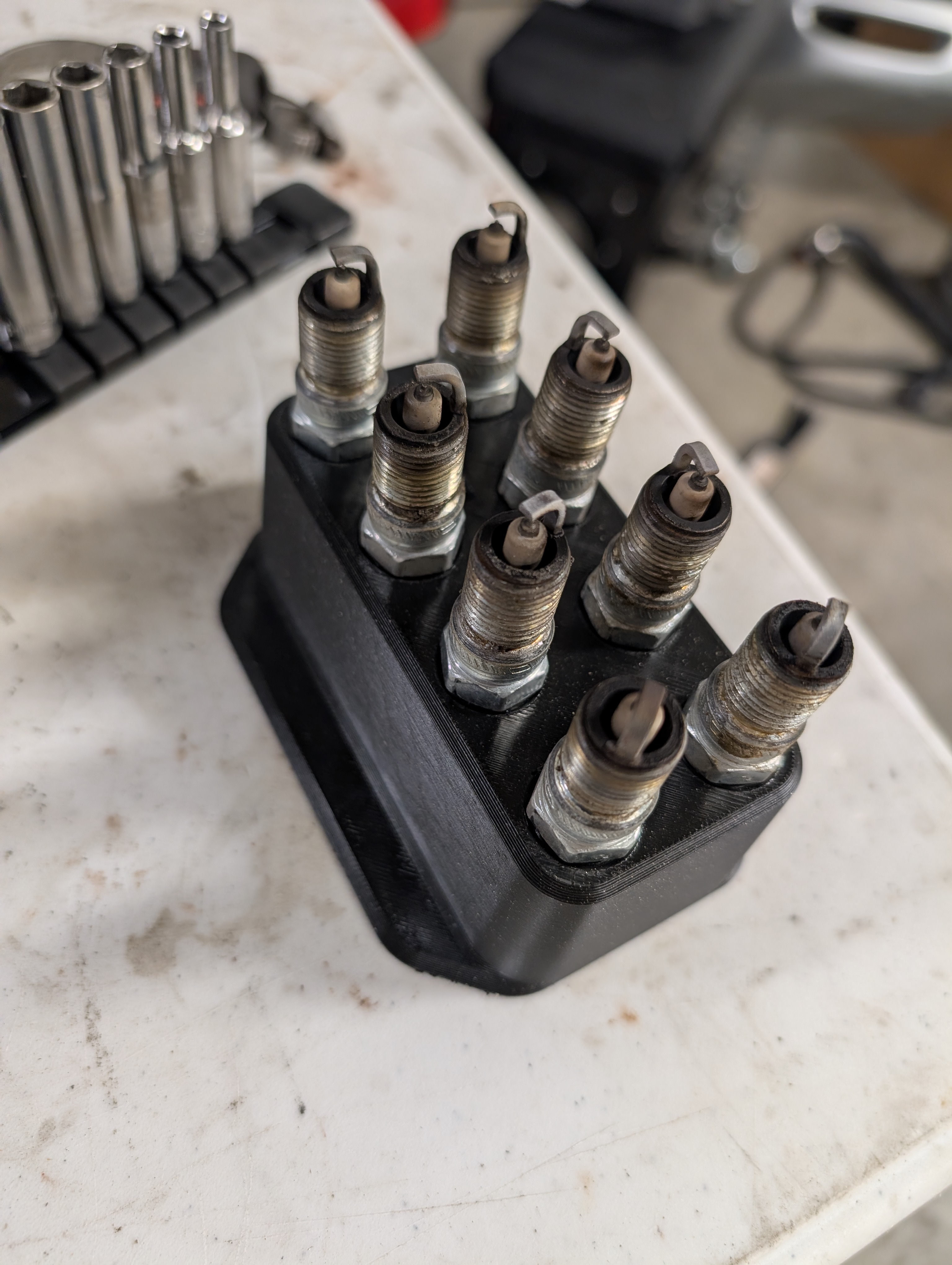 Eight spark plugs as removed from the C5 LS1 engine