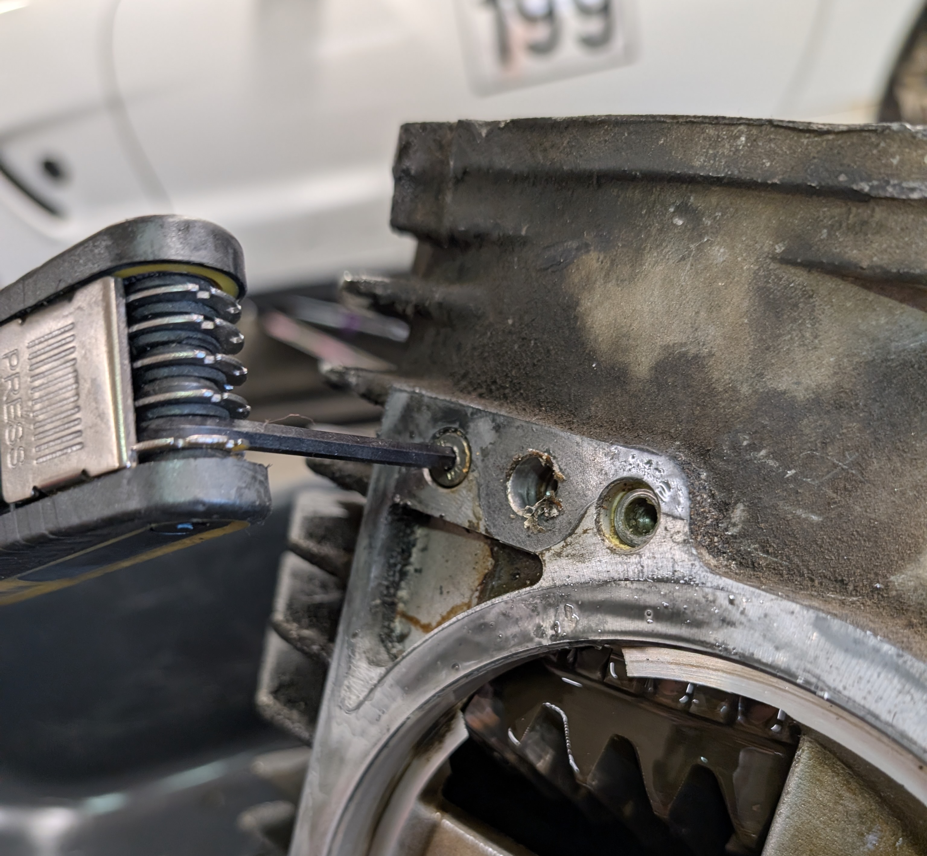 An Allen tool being used to remove the stud block retention bolts on a C5 Corvette differential