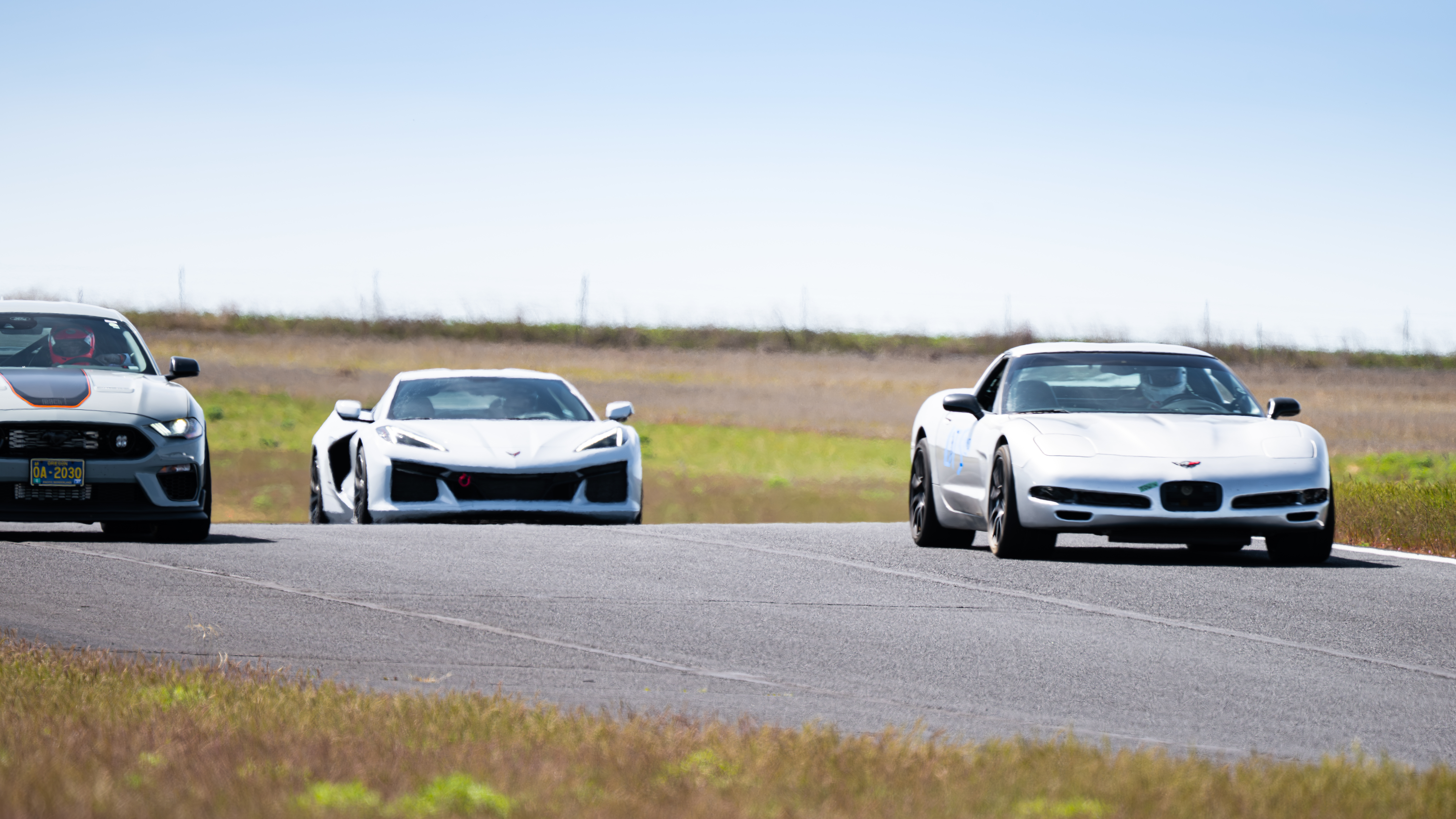 The Dead to Shred Corvette pulling on a modern mustang and C8 Corvete at ORP