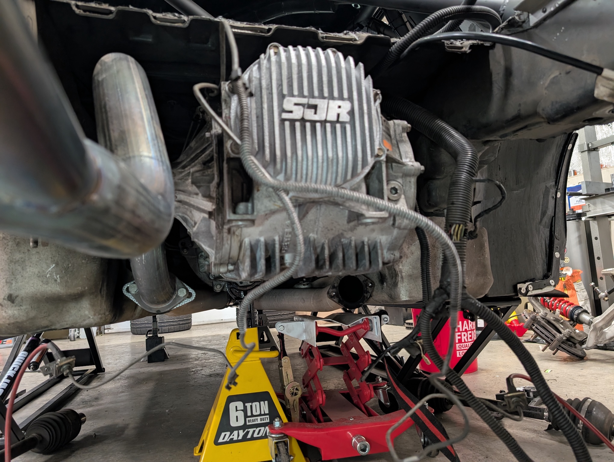 A C5 Corvette differential reinstalled in the back of a C5 Corvette, prominently featuring the Shred Jesse Racing (SJR) differential cover