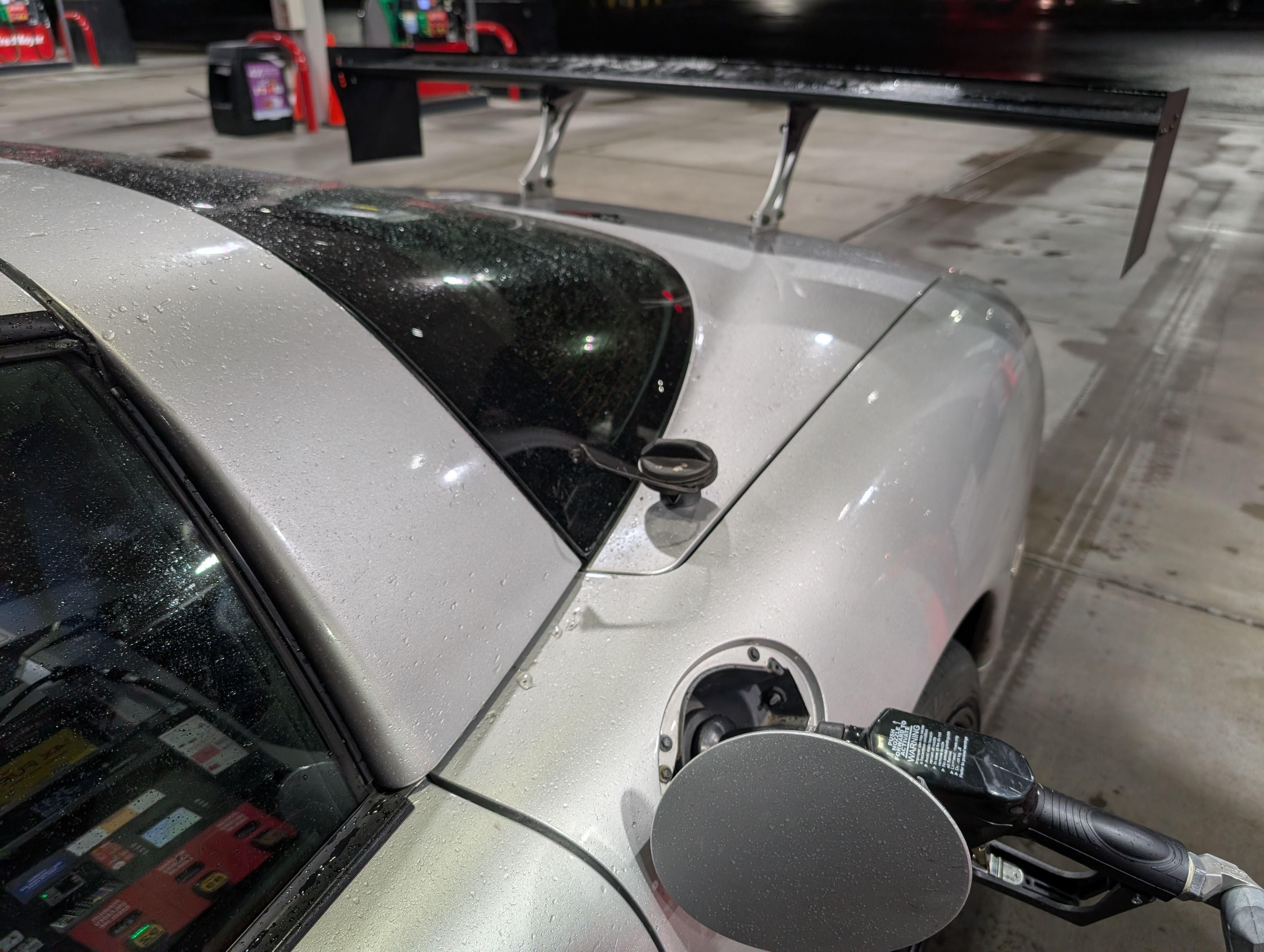 The Shred Jesse Wing on the Dead to Shred C5 Corvette, at a gas station getting gas.