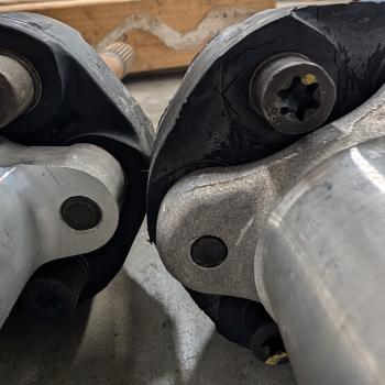Two torque tube shafts with guibos side by side. One is the 10mm and one is the 12mm, though barely discernable.