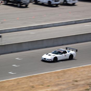 A White C5 Corvette on the front straight at The Ridge