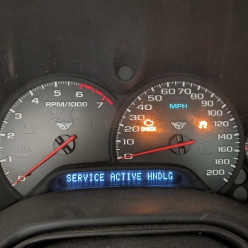 A C5 Corvette dash displaying the dreaded "Service active hndlng" message indicating a possible EBCM issue.